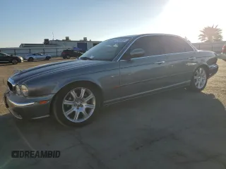 2004 Jaguar XJ with VIN SAJWA71C74SG20299, listed as a Copart auction lot 79469504 with 78,134 mi miles and Salvage Title. Bid and sale history available at carsss.com. Image 1.