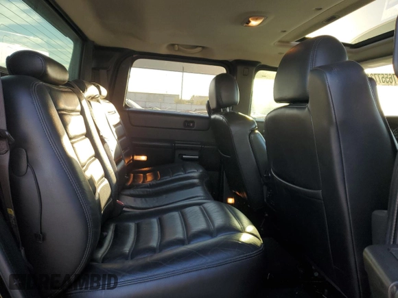 2005 Hummer H2 SUT z VIN 5GRGN22U85H109003, wystawiony jako Copart lot #76557734 z przebiegiem 115 249 mil mil oraz Szkoda całkowita • Salvage title. Historia ofert i sprzedaży dostępna na DreamBid. Obrazek 11.