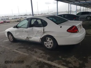2003 Ford Taurus LX Standard with VIN 1FAFP52U53G280700, listed as a Copart auction lot 87488014 with 128,020 mi miles and Salvage title. Bid and sale history available at DreamBid. Image 2.