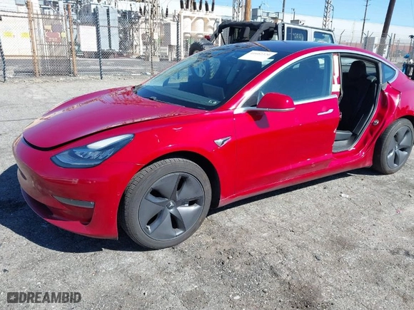 2018 Tesla Model 3 Long Range Battery with VIN 5YJ3E1EA6JF022061, listed as a IAAI auction lot 41602320 with 131,653 mi miles. Bid and sale history available at carsss.com. Image 2.