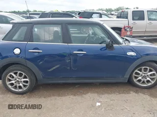 2017 MINI Hardtop 4 Door Cooper S z VIN WMWXU3C3XH2F49313, wystawiony jako IAAI lot #42137594 z przebiegiem 87 865 mil mil oraz . Historia ofert i sprzedaży dostępna na DreamBid. Obrazek 6.
