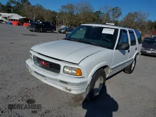 1997 GMC Jimmy SL with VIN 1GKCS13W9V2523837, listed as a IAAI auction lot 41359854 with 185,549 mi miles. Bid and sale history available at carsss.com. Image 2.