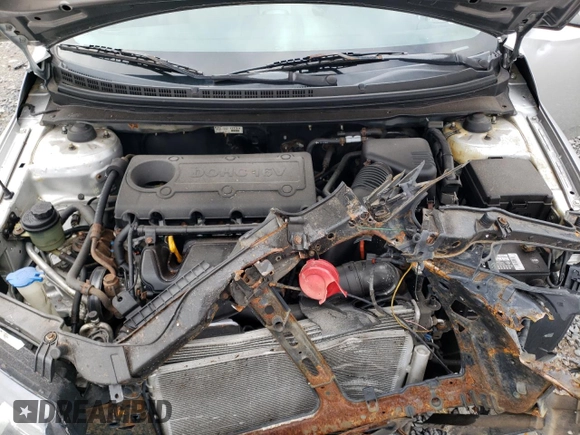 2010 Kia Forte EX z VIN KNAFU4A28A5109118, wystawiony jako Copart lot #56460755 z przebiegiem 143 845 mil mil oraz Szkoda całkowita • Salvage title. Historia ofert i sprzedaży dostępna na DreamBid. Obrazek 11.