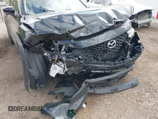 2024 Mazda CX-50 S Premium with VIN 7MMVABDM0RN185128, listed as a IAAI auction lot 42383177 with 21,267 mi miles and . Bid and sale history available at DreamBid. Image 6.