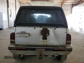 1990 Geo Tracker z VIN 2CNBJ18UXL6218795, wystawiony jako Copart lot #53083615 z przebiegiem 83 413 mil mil oraz Szkody całkowita. Historia ofert i sprzedaży dostępna na DreamBid. Obrazek 6.