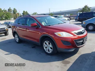 2012 Mazda CX-9 Touring z VIN JM3TB2CV4C0369210, wystawiony jako IAAI lot #42417575 z przebiegiem 159 551 mil mil oraz . Historia ofert i sprzedaży dostępna na DreamBid. Obrazek 1.
