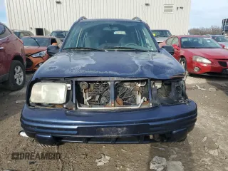 2000 Suzuki Vitara JX z VIN 2S3TD52V6Y6111082, wystawiony jako Copart lot #82444534 z przebiegiem 271 122 mil mil oraz Nie do naprawy. Historia ofert i sprzedaży dostępna na DreamBid. Obrazek 5.