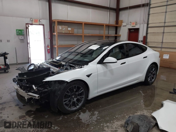 2022 Tesla Model S with VIN 5YJSA1E59NF469984, listed as a IAAI auction lot 42426490 with Not provided miles and . Bid and sale history available at DreamBid. Image 2.