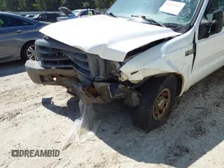 1999 Ford Super Duty F-250 XL with VIN 1FTNF20L3XEC76809, listed as a IAAI auction lot 40153294 with 457,050 mi miles. Bid and sale history available at carsss.com. Image 6.
