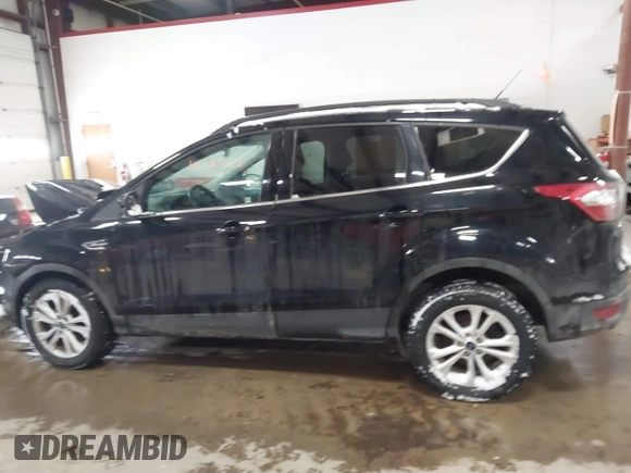 2017 Ford Escape SE with VIN 1FMCU9GD8HUE81307, listed as a IAAI auction lot 41386675 with 133,821 mi miles and . Bid and sale history available at DreamBid. Image 14.