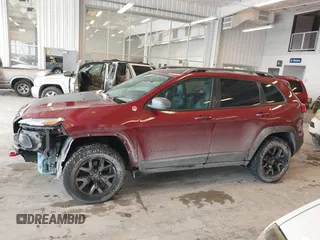 2016 Jeep Cherokee Trailhawk with VIN 1C4PJMBBXGW135138, listed as a IAAI auction lot 41595718 with 267,058 mi miles and . Bid and sale history available at DreamBid. Image 14.