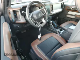 2021 Ford Bronco z VIN 1FMDE5CP4MLA65927, wystawiony jako Copart lot #74809974 z przebiegiem 41 296 mil mil oraz Nie do naprawy • Non repairable. Historia ofert i sprzedaży dostępna na DreamBid. Obrazek 8.