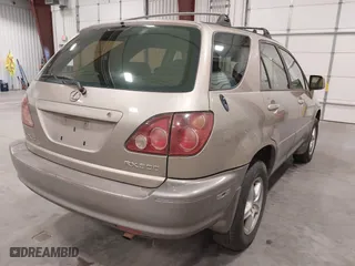 1999 Lexus RX 300 Luxury SUV with VIN JT6HF10U1X0013464, listed as a IAAI auction lot 42088616 with 254,653 mi miles. Bid and sale history available at carsss.com. Image 4.