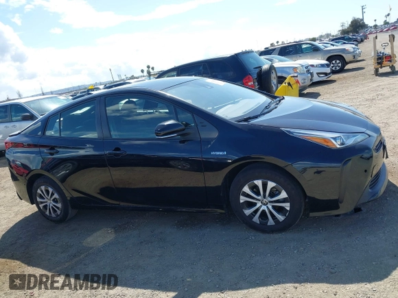 2021 Toyota Prius L Eco with VIN JTDKAMFU6M3135799, listed as a IAAI auction lot 42064241 with 77,120 mi miles and . Bid and sale history available at DreamBid. Image 13.