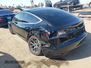 2018 Tesla Model 3 Long Range Battery with VIN 5YJ3E1EA0JF056979, listed as a IAAI auction lot 41865849 with 97,319 mi miles. Bid and sale history available at carsss.com. Image 3.