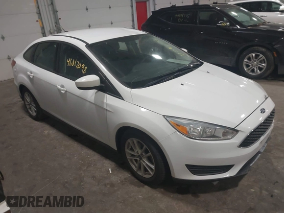 2018 Ford Focus SE with VIN 1FADP3F29JL312721, listed as a IAAI auction lot 41012098 with 126,214 mi miles. Bid and sale history available at carsss.com. Image 1.