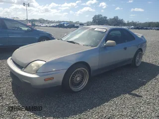 2000 Honda Prelude with VIN JHMBB6243YC003540, listed as a Copart auction lot 77273364 with 210,702 mi miles and Salvage Title. Bid and sale history available at DreamBid. Image 1.