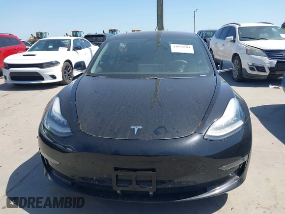 2018 Tesla Model 3 Long Range Battery with VIN 5YJ3E1EA7JF098632, listed as a IAAI auction lot 42002181 with 73,371 mi miles and . Bid and sale history available at DreamBid. Image 13.
