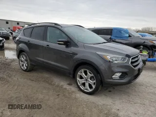 2017 Ford Escape Titanium with VIN 1FMCU9J99HUB79870, listed as a Copart auction lot 47469655 with 58,683 mi miles and Salvage Title. Bid and sale history available at carsss.com. Image 4.