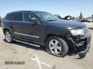 2011 Jeep Grand Cherokee Laredo with VIN 1J4RR4GG0BC563603, listed as a Copart auction lot 60237475 with 243,885 mi miles and Salvage title. Bid and sale history available at DreamBid. Image 4.