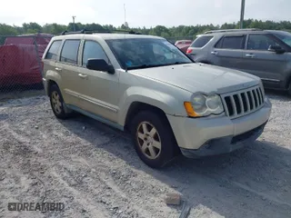 2010 Jeep Grand Cherokee Laredo with VIN 1J4PS4GK6AC136702, listed as a IAAI auction lot 42066484 with 126,509 mi miles. Bid and sale history available at carsss.com. Image 1.