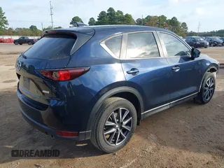 2018 Mazda CX-5 Touring z VIN JM3KFACM0J1389057, wystawiony jako IAAI lot #40922679 z przebiegiem 140 026 mil mil oraz . Historia ofert i sprzedaży dostępna na DreamBid. Obrazek 4.