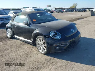 2014 Volkswagen Beetle 1.8T with VIN 3VW517AT4EM815243, listed as a IAAI auction lot 41245346 with 119,259 mi miles and . Bid and sale history available at DreamBid. Image 1.