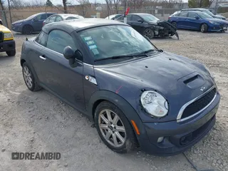 2013 MINI Coupe S with VIN WMWSX3C50DT466882, listed as a IAAI auction lot 42026938 with 99,499 mi miles and . Bid and sale history available at DreamBid. Image 1.