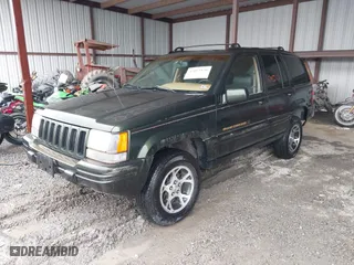 1997 Jeep Grand Cherokee Limited with VIN 1J4GZ78Y5VC723429, listed as a IAAI auction lot 42012836 with 231,126 mi miles. Bid and sale history available at carsss.com. Image 2.
