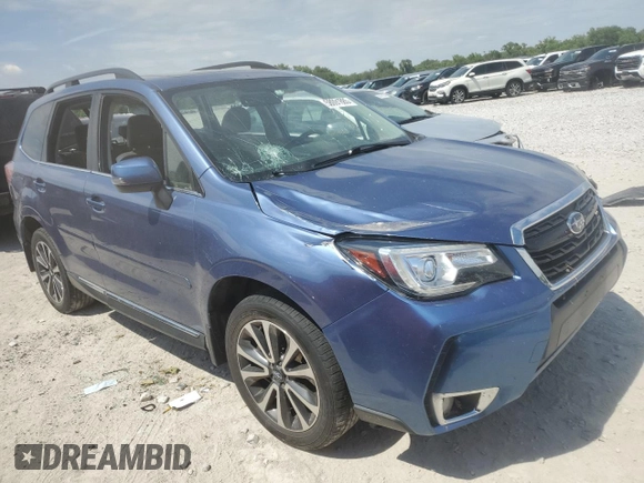 2017 Subaru Forester Touring with VIN JF2SJGTC2HH404923, listed as a Copart auction lot 58091885 with 101,317 mi miles and Salvage title. Bid and sale history available at DreamBid. Image 4.