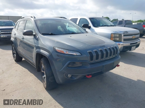 2014 Jeep Cherokee Trailhawk z VIN 1C4PJMBS2EW161276, wystawiony jako IAAI lot #42283358 z przebiegiem 135 201 mil mil oraz . Historia ofert i sprzedaży dostępna na DreamBid. Obrazek 1.