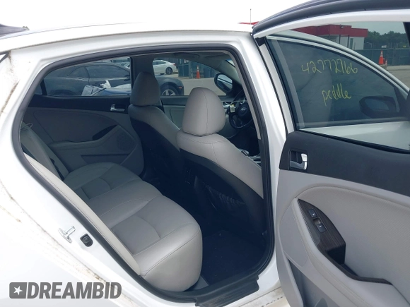 2015 Kia Optima EX with VIN 5XXGN4A77FG452747, listed as a IAAI auction lot 42772766 with 97,243 mi miles and . Bid and sale history available at DreamBid. Image 8.
