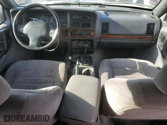 1998 Jeep Grand Cherokee Laredo with VIN 1J4GZ58S6WC319444, listed as a Copart auction lot 53147665 with 217,068 mi miles and Salvage Title. Bid and sale history available at carsss.com. Image 8.