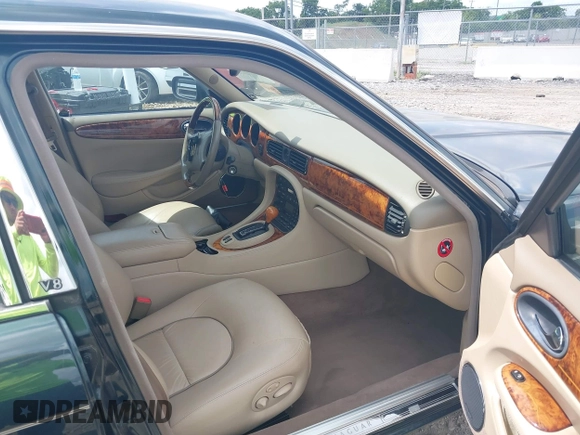 1999 Jaguar XJ with VIN SAJKD6048XC869099, listed as a IAAI auction lot 42761055 with 124,326 mi miles and . Bid and sale history available at DreamBid. Image 5.