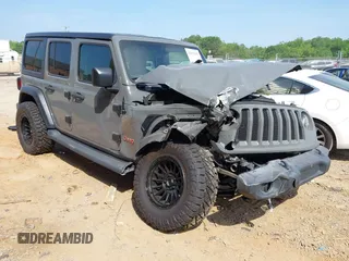 2019 Jeep Wrangler Unlimited Sport S z VIN 1C4HJXDG3KW662946, wystawiony jako IAAI lot #42157025 z przebiegiem 26 096 mil mil oraz . Historia ofert i sprzedaży dostępna na DreamBid. Obrazek 1.