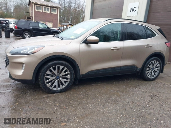 2021 Ford Escape Titanium Hybrid with VIN 1FMCU9DZXMUA66161, listed as a IAAI auction lot 41208651 with 61,198 mi miles and . Bid and sale history available at DreamBid. Image 14.