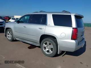 2015 Chevrolet Tahoe LTZ with VIN 1GNSKCKC5FR205739, listed as a IAAI auction lot 40020644 with 142,524 mi miles and . Bid and sale history available at DreamBid. Image 3.