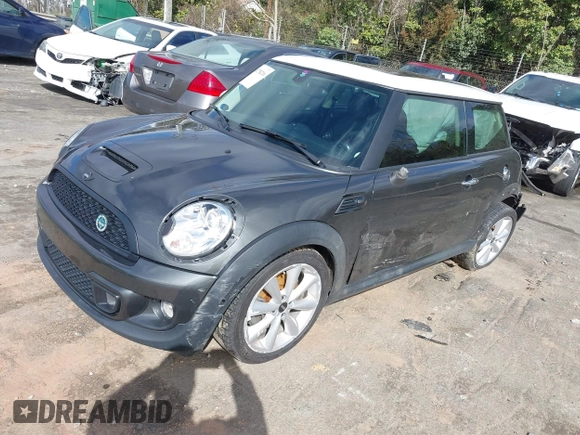 2013 MINI Hardtop S with VIN WMWSV3C50DT394345, listed as a IAAI auction lot 41738216 with 58,241 mi miles and . Bid and sale history available at DreamBid. Image 2.