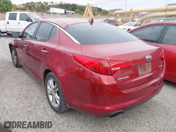 2013 Kia Optima EX z VIN 5XXGN4A74DG110086, wystawiony jako IAAI lot #40963304 z przebiegiem 137 377 mil mil oraz . Historia ofert i sprzedaży dostępna na DreamBid. Obrazek 3.
