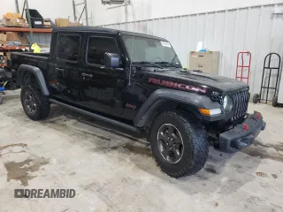 2020 Jeep Gladiator Rubicon with VIN 1C6JJTBG9LL183888, listed as a Copart auction lot 70225794 with 57,969 mi miles and Salvage title. Bid and sale history available at DreamBid. Image 4.