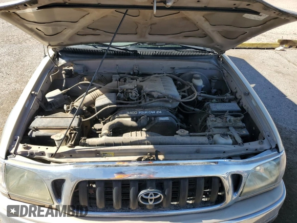 2002 Toyota Tacoma z VIN 5TEWN72N62Z899270, wystawiony jako Copart lot #54070605 z przebiegiem 243 516 mil mil oraz Czysty tytuł • Clean title. Historia ofert i sprzedaży dostępna na DreamBid. Obrazek 11.