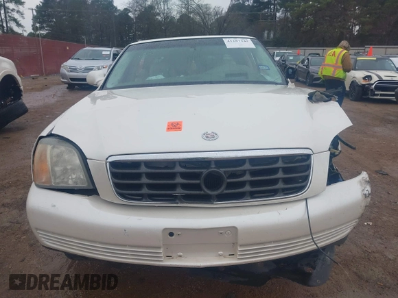 2002 Cadillac DeVille DHS z VIN 1G6KE57YX2U212020, wystawiony jako IAAI lot #41287342 z przebiegiem Nie podano mil oraz . Historia ofert i sprzedaży dostępna na DreamBid. Obrazek 12.