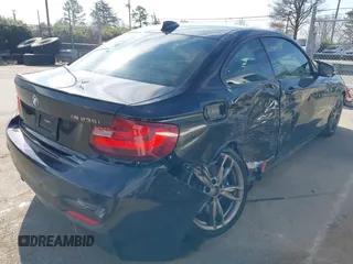 2015 BMW 2 Series M235i with VIN WBA1J7C55FV358964, listed as a IAAI auction lot 41674800 with 63,504 mi miles and . Bid and sale history available at carsss.com. Image 4.