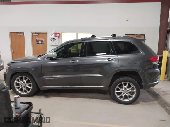 2015 Jeep Grand Cherokee Summit with VIN 1C4RJFJT6FC754799, listed as a IAAI auction lot 41699124 with 124,206 mi miles and . Bid and sale history available at DreamBid. Image 14.