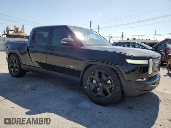 2023 Rivian R1T Adventure z VIN 7FCTGBAA6PN029702, wystawiony jako Copart lot #49833425 z przebiegiem 6608 mil mil oraz Szkody całkowita. Historia ofert i sprzedaży dostępna na DreamBid. Obrazek 4.