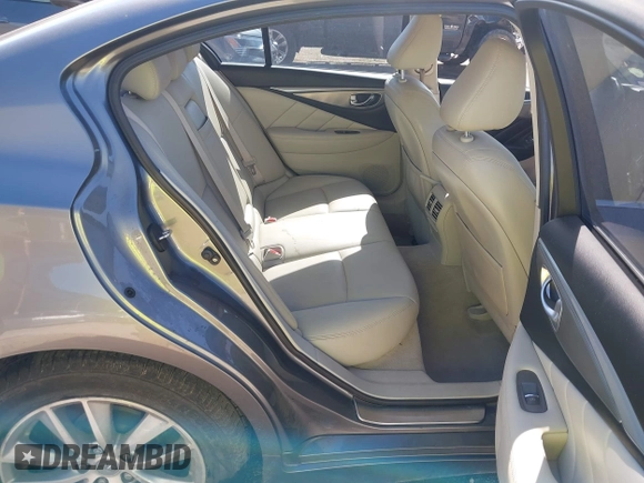 2015 Infiniti Q50 Premium z VIN JN1BV7AR9FM408386, wystawiony jako IAAI lot #42084887 z przebiegiem 122 527 mil mil oraz . Historia ofert i sprzedaży dostępna na DreamBid. Obrazek 8.