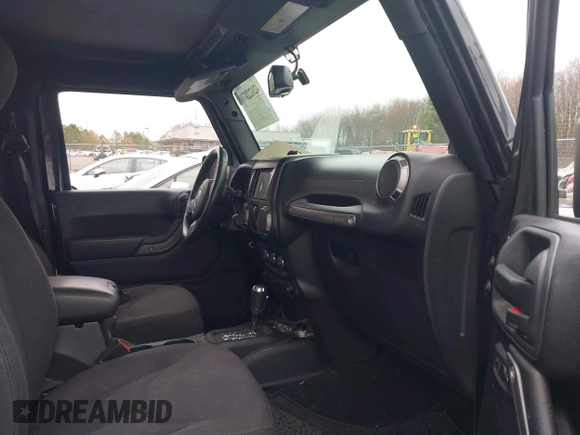 2014 Jeep Wrangler Sport with VIN 1C4AJWAG9EL312856, listed as a IAAI auction lot 42022870 with 98,323 mi miles and . Bid and sale history available at DreamBid. Image 5.