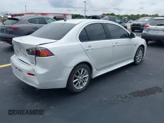 2016 Mitsubishi Lancer ES z VIN JA32U2FU7GU000923, wystawiony jako IAAI lot #42238951 z przebiegiem 134 955 mil mil oraz . Historia ofert i sprzedaży dostępna na DreamBid. Obrazek 4.