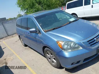 2010 Honda Odyssey Touring with VIN 5FNRL3H99AB026408, listed as a IAAI auction lot 42770778 with 190,951 mi miles and . Bid and sale history available at DreamBid. Image 1.