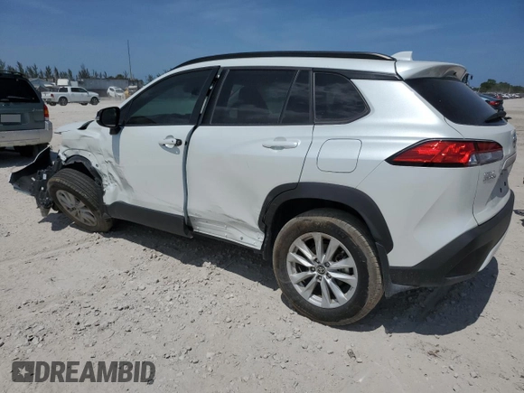 2024 Toyota Corolla Cross LE with VIN 7MUCAAAG7RV090677, listed as a Copart auction lot 57615565 with 6,910 mi miles and Salvage title. Bid and sale history available at DreamBid. Image 2.